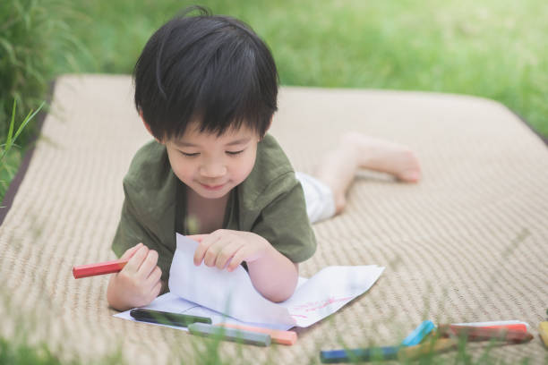 istock child drawing picture with crayon 656607508
