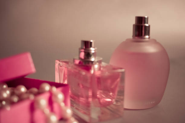 istock Close-up perfume bottles and pink box with pearl beads 656616094