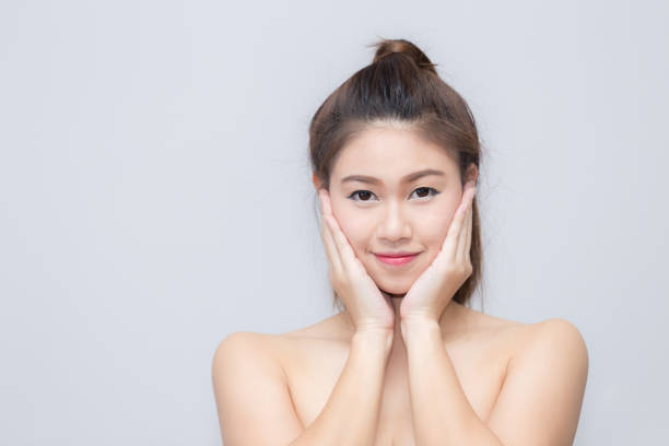istock Asian beautiful woman smiling and touch her cheek 656622088