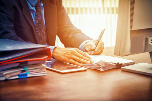 Businessman Writing At Cafe