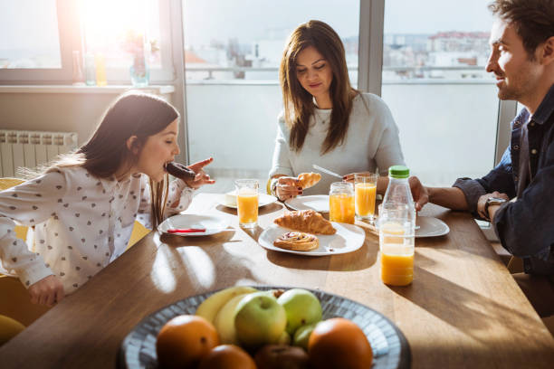 istock young family enjoying breakfast together 656624334