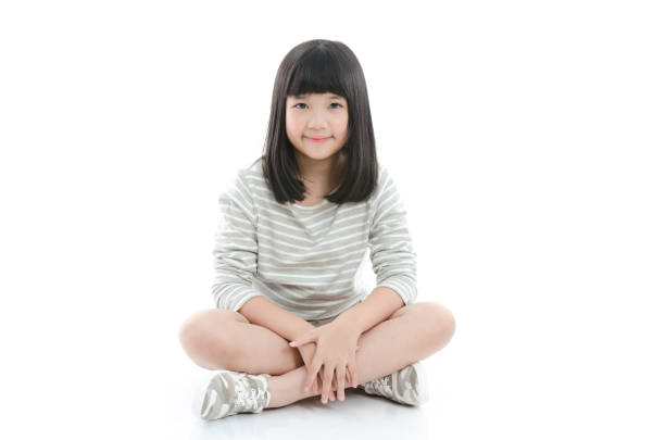 istock Beautiful asian girl sitting on white background 656630522