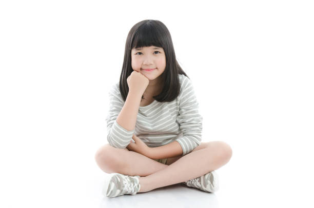 istock Beautiful asian girl sitting on white background 656630526