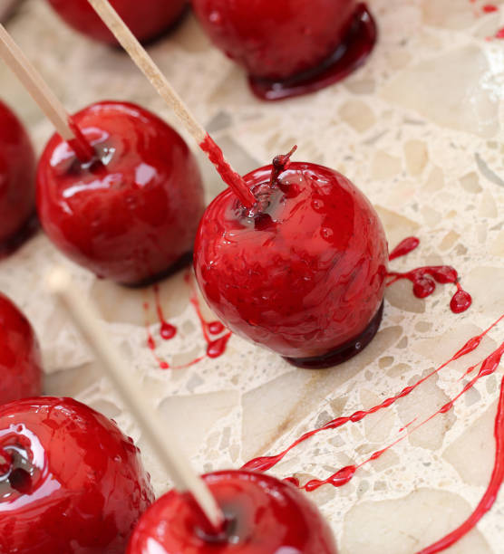 istock apples with caramelized sugar syrup and the wooden stick 656635098