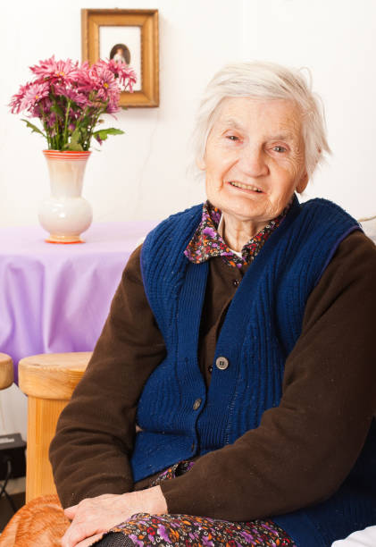 istock Elderly lonely woman sitting on the bed 656638522