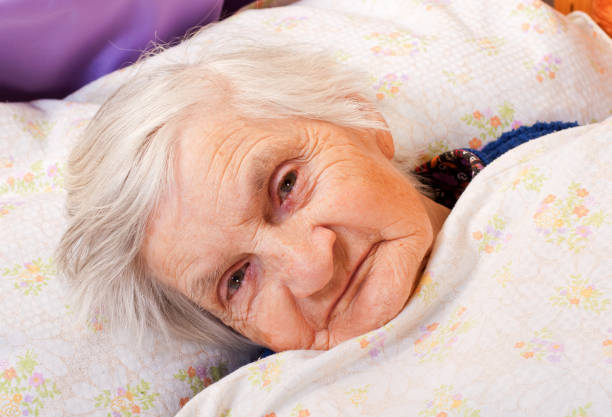 istock Elderly lonely woman rests in the bed 656638946