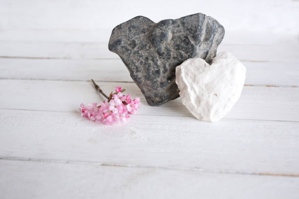 Still life with two hearts of stone in vintage style for love greetings
