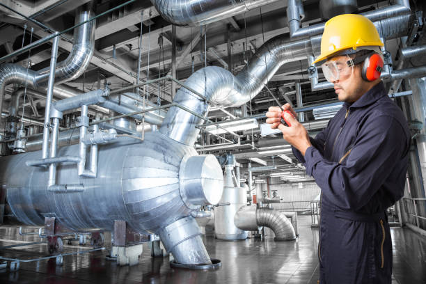 istock Engineer working in a thermal power plant with radio 656648536