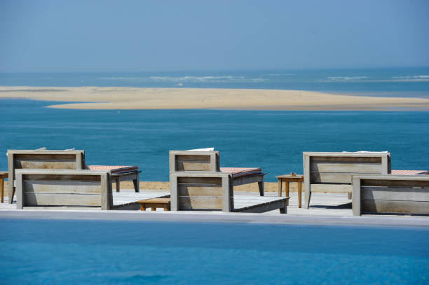 istock Beautiful tropical beach with chairs and swimingroom 656649966