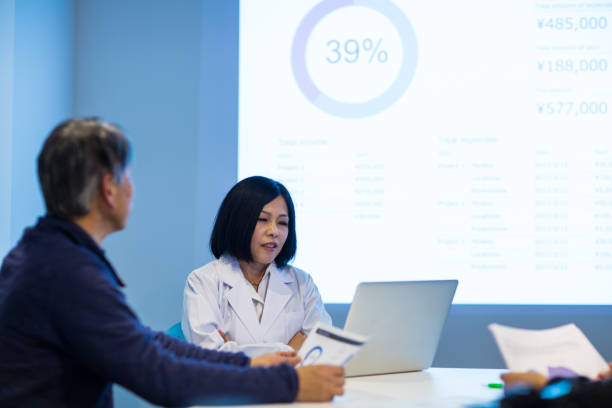 Female doctor giving a speech or presentation to colleagues