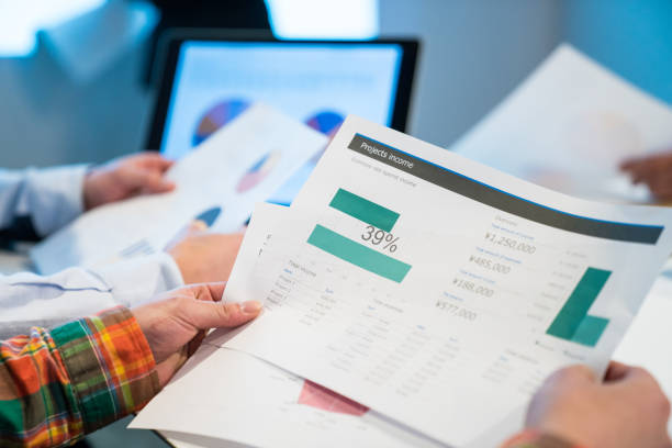 istock Close up of hands holding documents at a business meeting 656653794