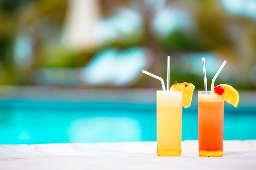 Two tasty alcoholic cocktails on tropical white beach