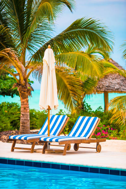 istock Beach chairs and umbrella at exotic tropical resort 656662336