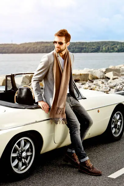 Sports car dude in scarf, looking away