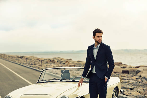 Suited with vintage car