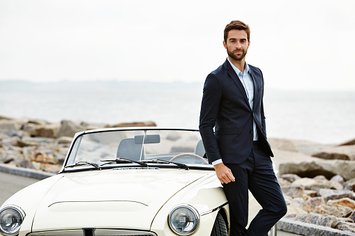 Dude in suit with cool car, portrait