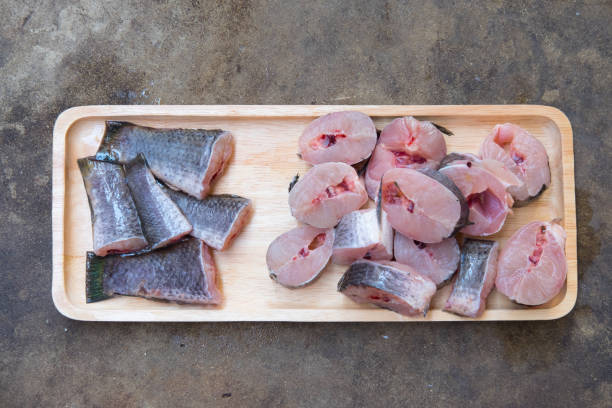 istock Striped snakehead fish chopped preparing for cooking on wood tray 656668838