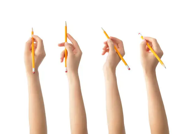 Photo of Hands with pencils set , isolated