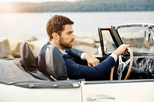 istock Dude in sports car 656669096