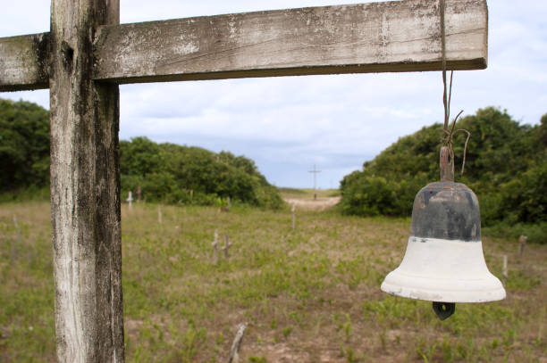 Old iron bell hanging in the farm land