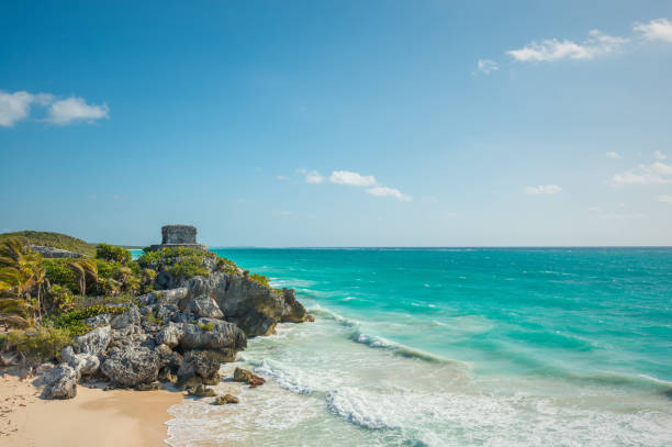 Tulum Ruins by the Caribbean Sea The ruins of the Mayan archaeological site of Tulum on a cliff by the Caribbean Sea in Mexico. playa del carmen stock pictures, royalty-free photos & images