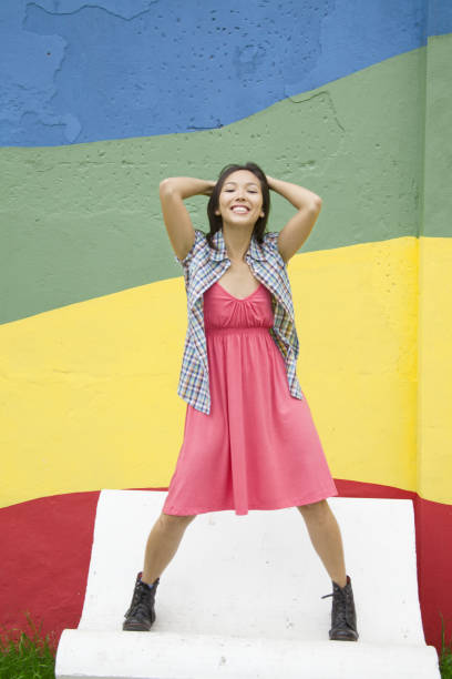 istock Young woman standing on the bench 656684680