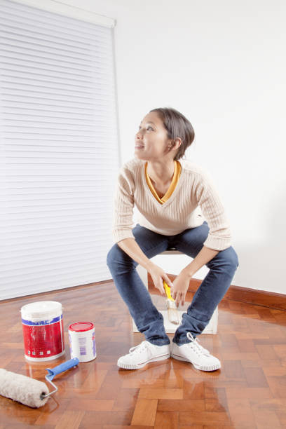 istock Young woman with a paint brush 656689046