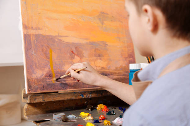istock Gifted boy painting in the art studio 656690088