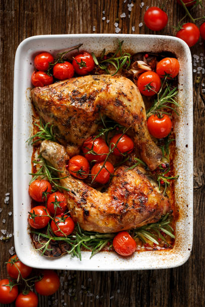istock Baked chicken quarter with cherry tomatoes and rosemary 656692180