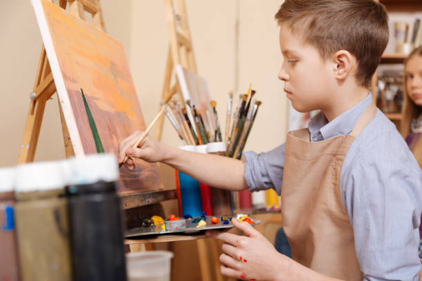 istock Involved young boy having lesson in the art school 656692236