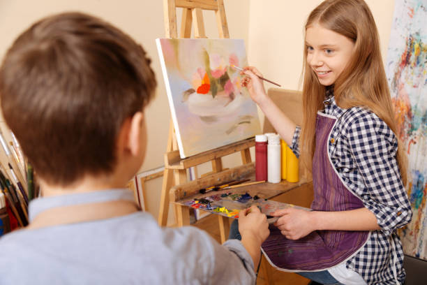 istock Cheerful children communicating at the art class 656692900