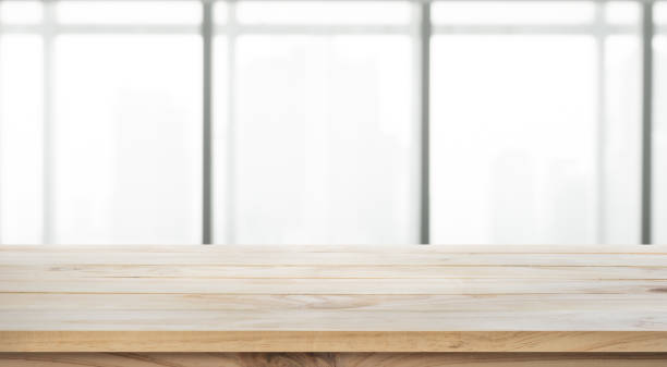 istock Wood table top on glass wall abstract background. 656693004