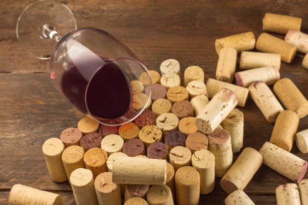 istock Glass of red wine and corks with place for text 656693030