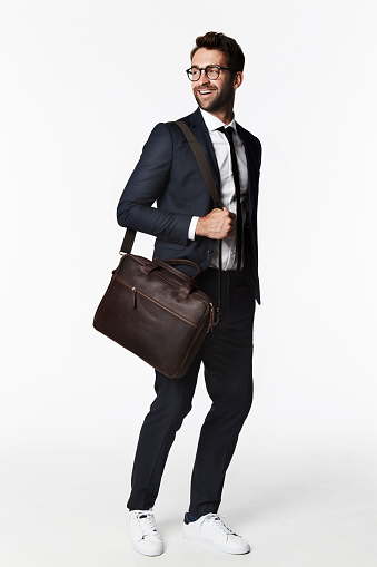 Laughing business guy with briefcase and suit