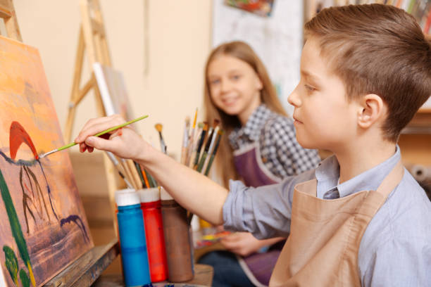 istock Positive children painting at the art class 656693316