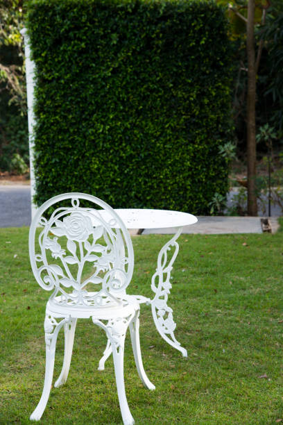 istock A chair and table in garden. 656693660