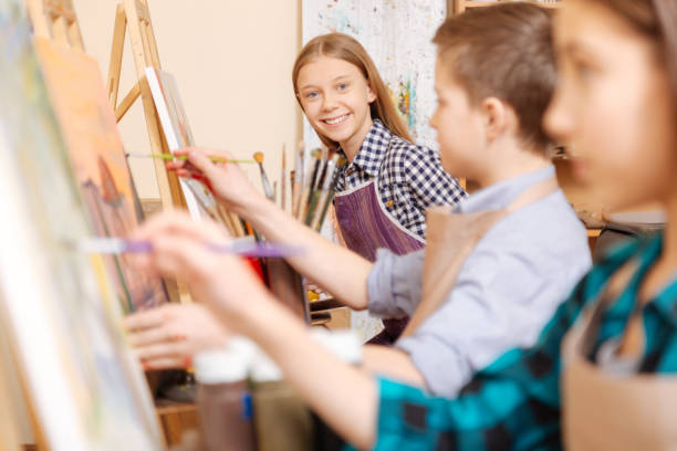 istock Cheerful friends painting in the art studio 656698214