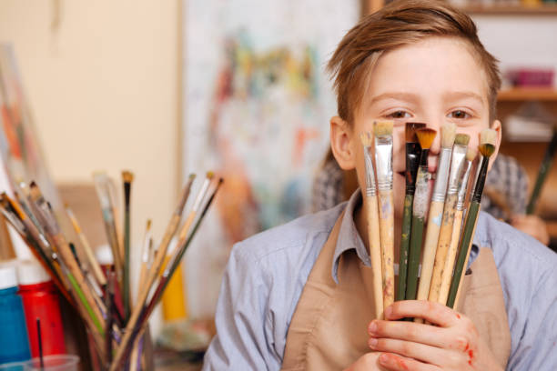 istock Joyful little boy having fun at school 656700160