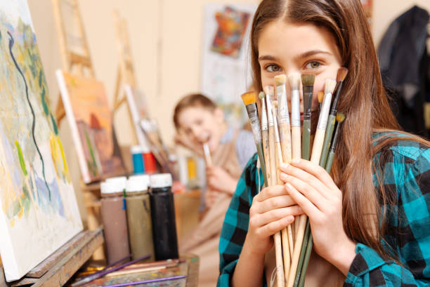 istock Positive kids having fun during the painting lesson 656700460