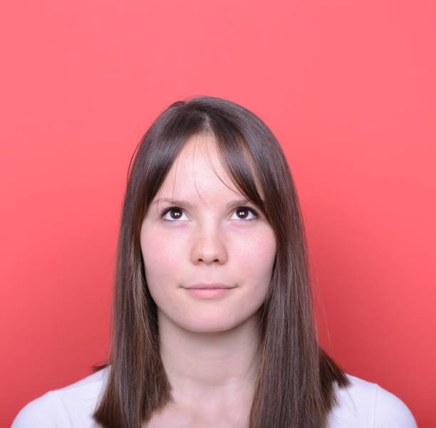 istock Portrait of thinking woman looking up 656704378
