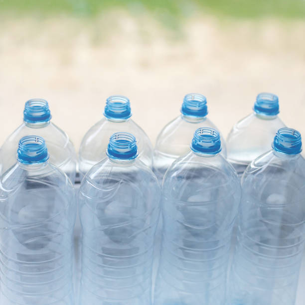 istock empty plastic water bottles on table - recycling and food storage concept 656712712