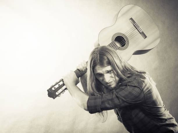 istock Rock musician destroys his guitar. 656722122