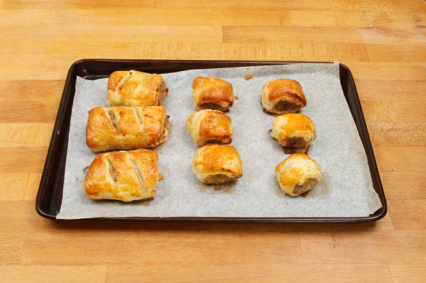 Sausage rolls on a baking tray