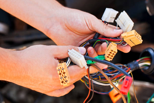 istock The young electrician man holds the wires 656737654