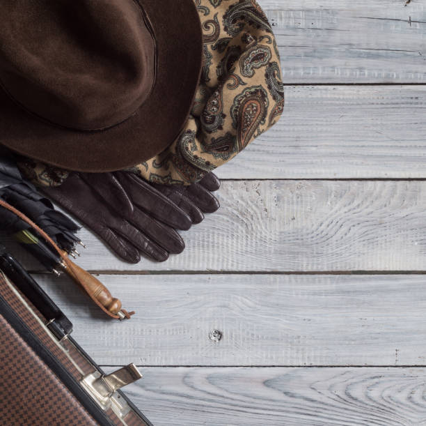 istock Man's hat and retro accessories for travel on a white painted wooden surface 656739890