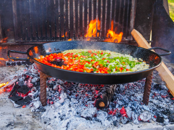 istock Cooking paella, a typical Spanish dish, in barbecue 656744432