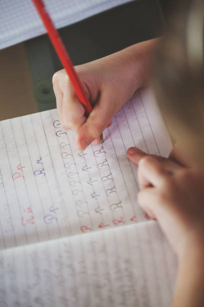 istock Beautiful schoolboy doing homework at home 656751724
