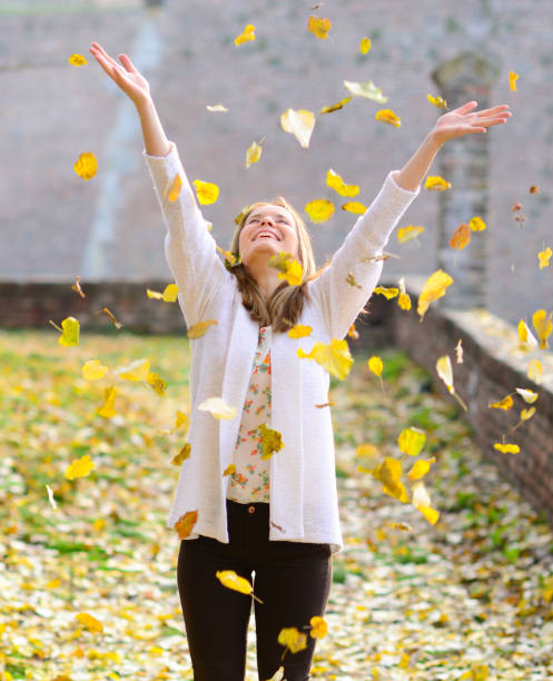 istock Happy woman enjoying autumn in park 656752702
