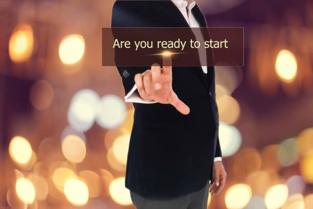 istock businessman pressing are you ready to start button 656758474