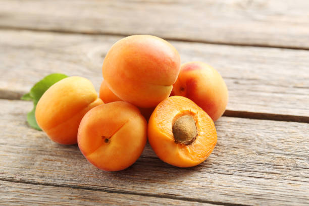 istock Ripe apricots fruit on grey wooden table 656766844
